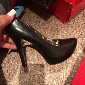 Black leather almond toe heel by Carlos Santana